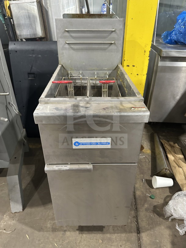 Standard Range SRF4LR stainless steel gas floor fryer with back splash and fryer basket. Good condition. Model: SRF4LR.