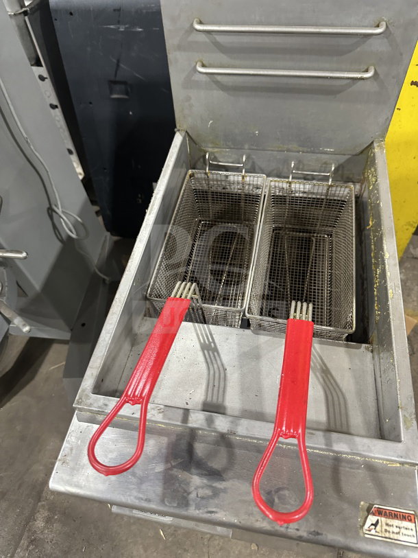Standard Range stainless steel gas floor deep fryer, model SRF4LR, with back splash, fryer baskets, on legs, fair condition.