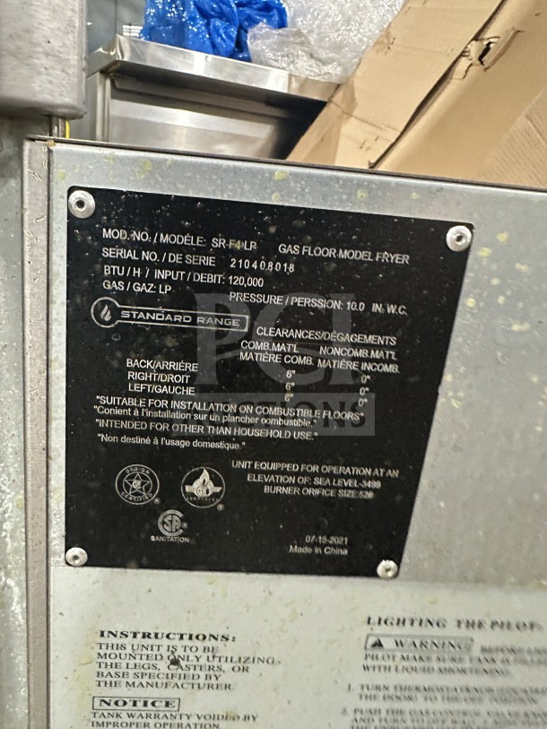 Standard Range SR-F4-LR stainless steel gas fryer, includes backsplash, fryer basket, on legs. Serial: 210408018.
