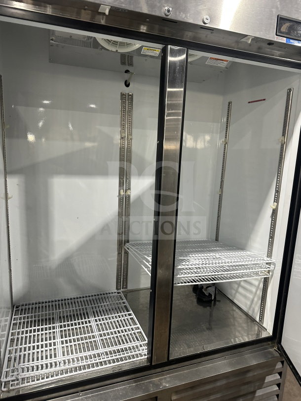 Beverage-Air stainless steel 2-door reach-in freezer, Model KF48-1AS. Includes poly-coated wire racks. Serial No. 9025103.