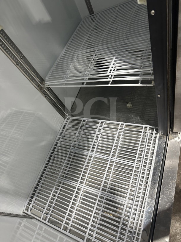Beverage-Air KF48-1AS commercial freezer interior with poly coated wire racks, stainless steel finish, two-door design.