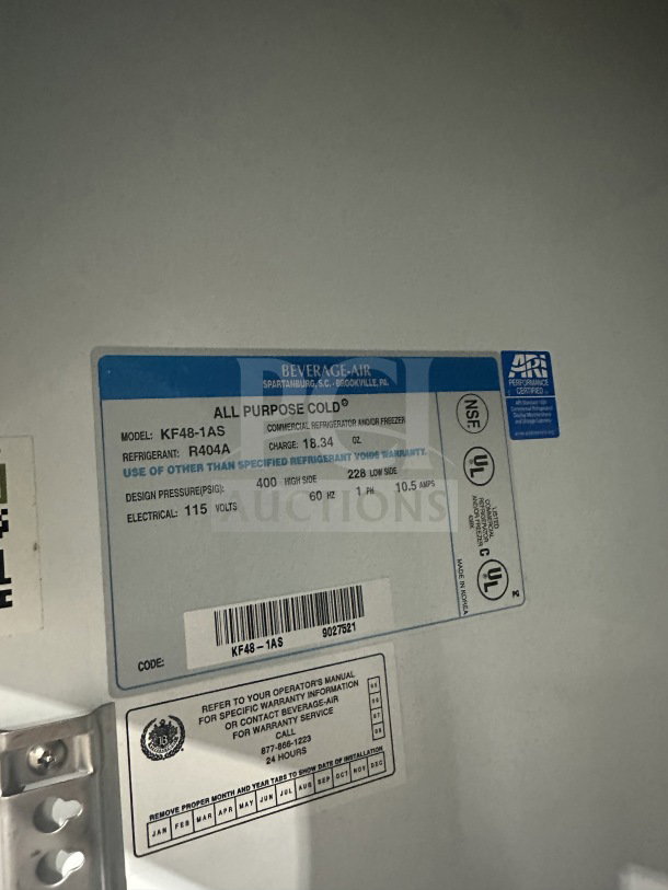 Beverage-Air KF48-1AS commercial stainless steel freezer with poly-coated rack, model label and specifications visible.