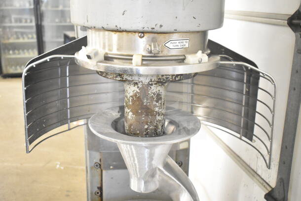 Hobart M802 commercial dough mixer with bowl guard, showing aged finish. Features bowl, dolly, and dough hook. 200V, 3-phase.