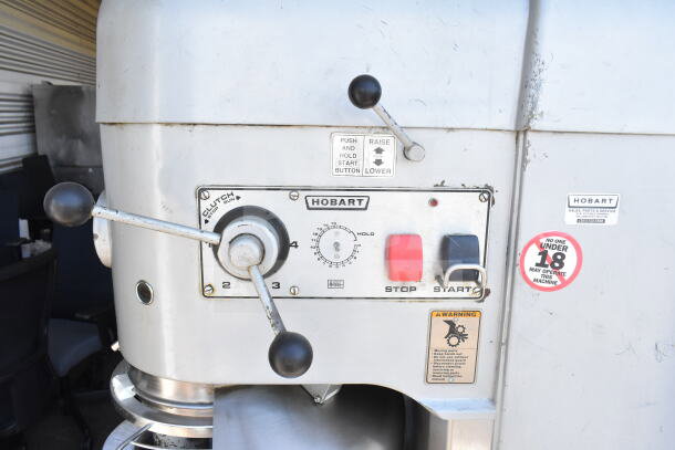 Hobart M802 commercial 80 qt dough mixer with bowl, dolly, guard, and hook, featuring control panel and safety labels.