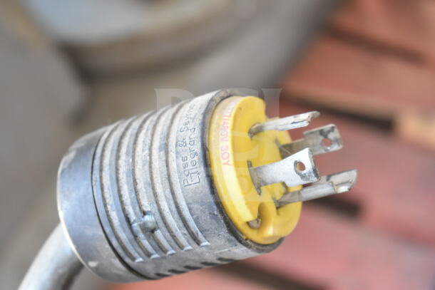 Close-up of a power plug for a Hobart M802 commercial dough mixer, showing voltage and phase details.