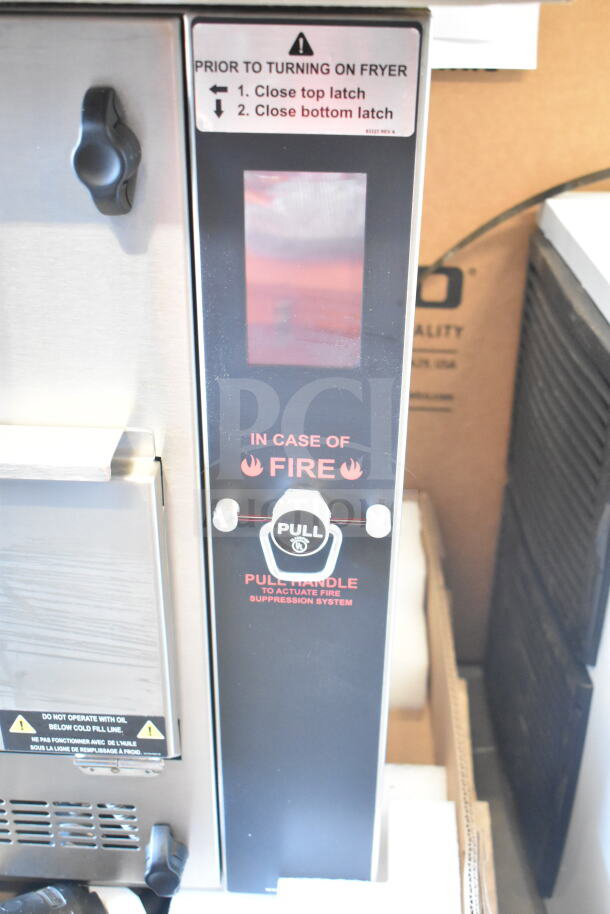 Brand new 2024 Perfect Fry PFC730 ventless countertop deep fryer, 240V, 3-phase, visible fire suppression handle and warning labels.