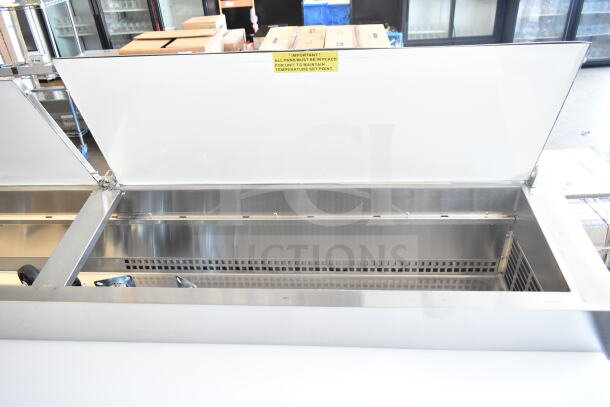 Brand new Avantco 178SSPPT3 commercial pizza prep table, 115 volts, 1 phase. Scratch and dent, with open lid view.