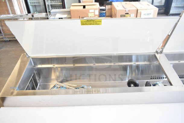 Brand new Avantco 178SSPPT3 commercial pizza prep table, 115V, 1 phase. Scratch and dent condition. Open top view.
