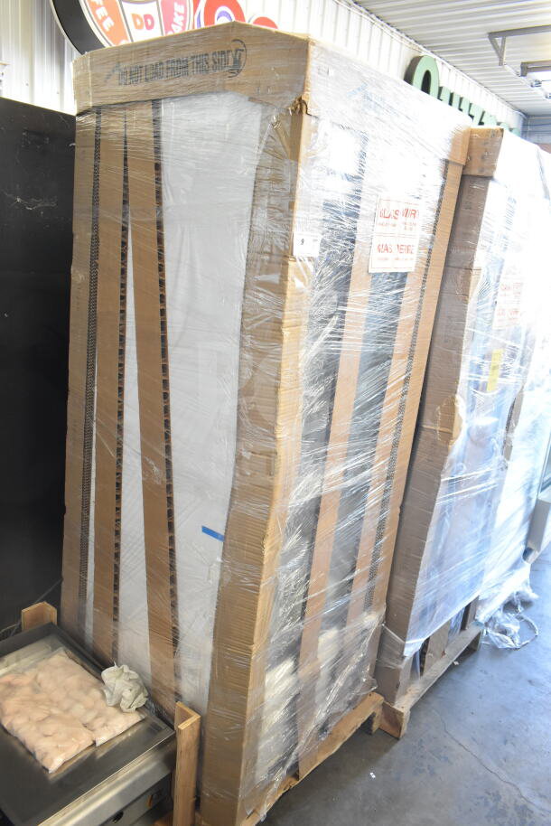 Brand new, True TSCI-600R-G-PH commercial single door cooler in original packaging, minor scratches, dented corners.