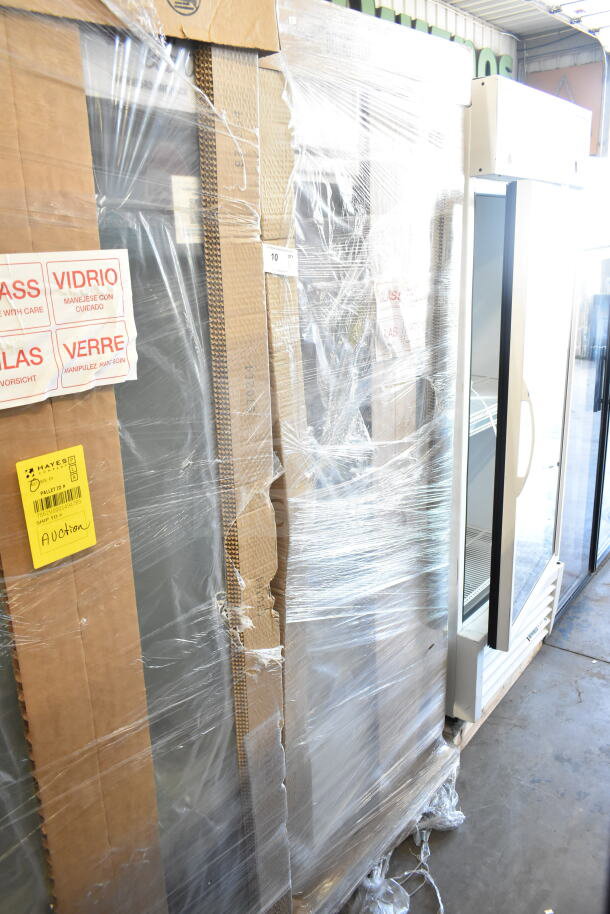 Brand new 2026 True TSCI-600R-G-PH single door cooler merchandiser, 115 volts, scratch and dent condition, packed with care labels.