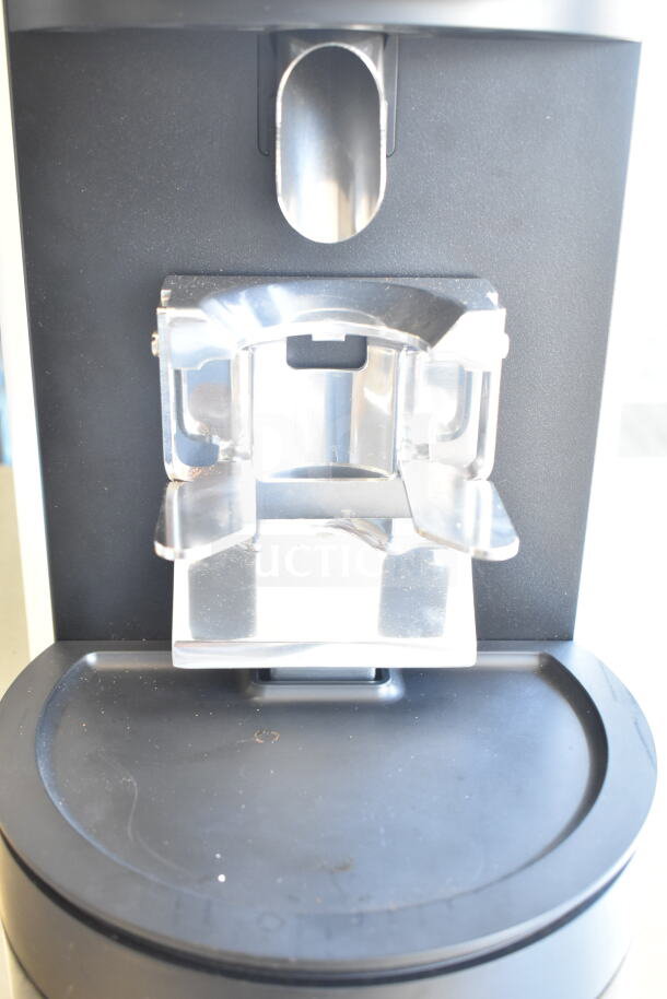 Brand new 2025 Mahlkonig E80W GBS white espresso grinder, showing grind chute and drip tray, minor scratches visible.