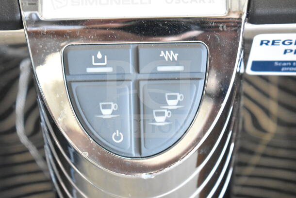 Nuova Simonelli OSCAR II AD espresso machine controls with visible button panel, showing signs of light scratching.
