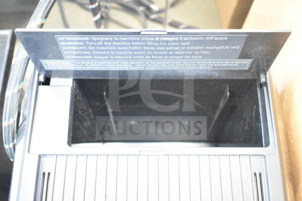 BRAND NEW SCRATCH AND DENT! 2025 Nuova Simonelli OSCAR II AD Black Espresso Machine, warning panel detail shown.