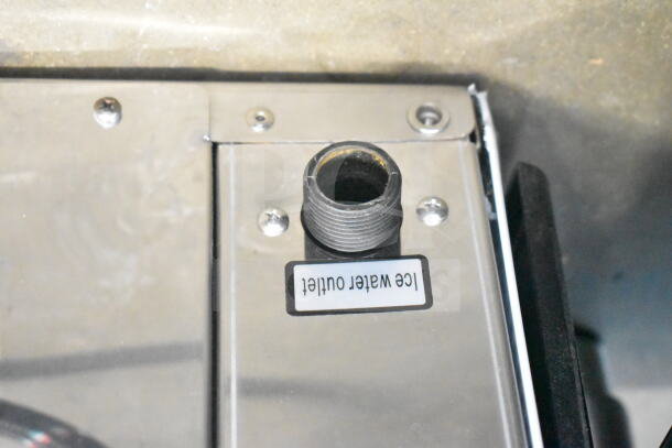 Brand new scratched Avantco 194MCF430A ice machine outlet; label reads "ice water outlet."