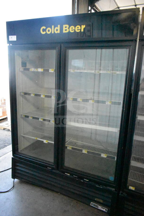 2019 True GDM-49-HC 2-door reach-in cooler merchandiser, 115 volts, 1 phase, tested and working, with "Cold Beer" signage.