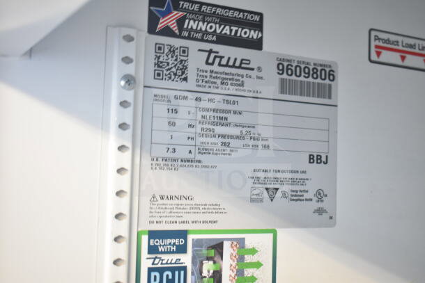 2019 True GDM-49-HC cooler label showing model, voltage, refrigerant R290, and warning signs for commercial use.