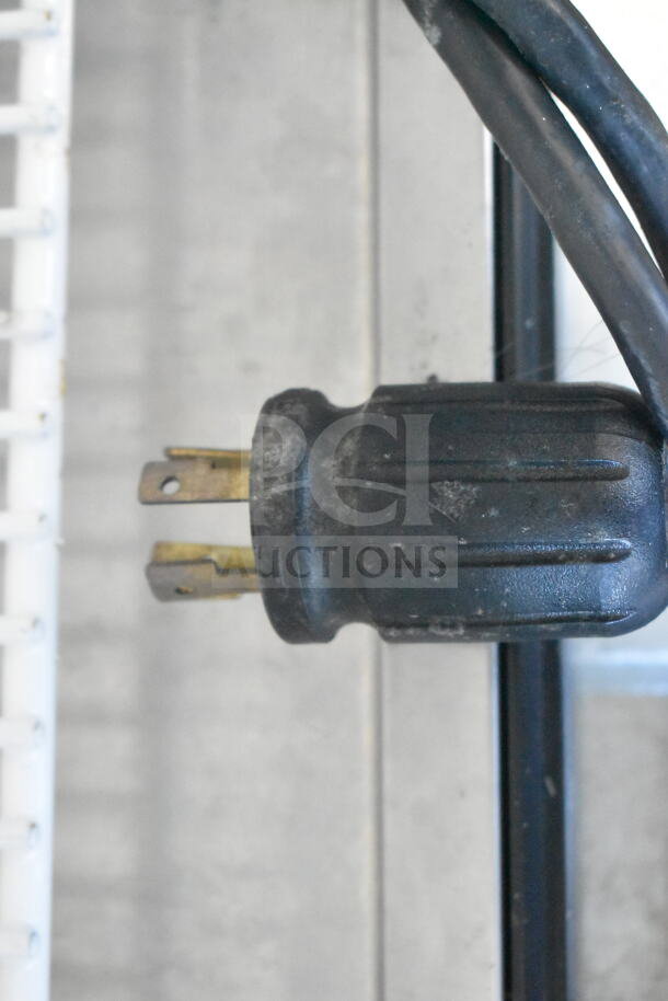 Close-up of the power plug for a 2016 True GDM-72F-HC Commercial Reach In Freezer, indicating electrical compatibility.
