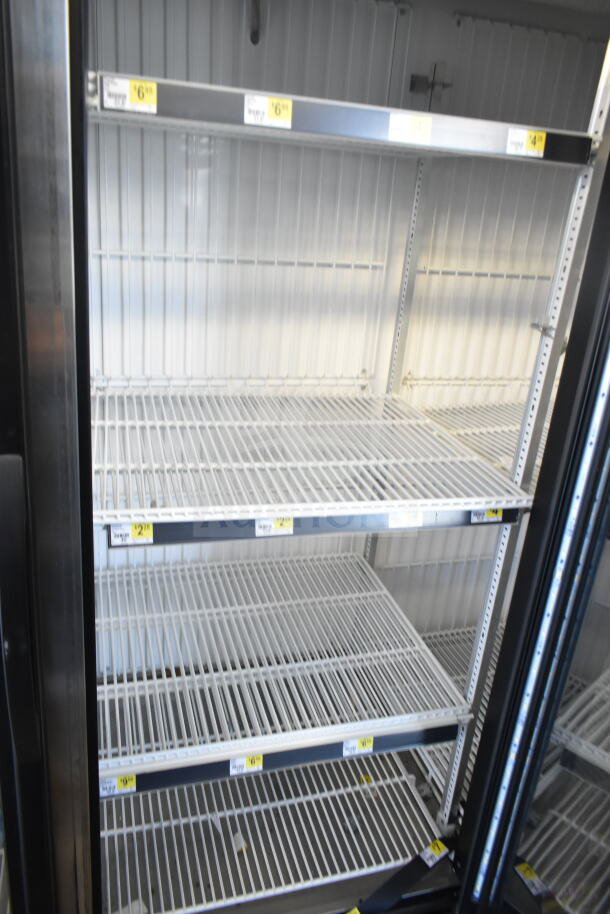 2016 True GDM-72F-HC 3 Door Reach In Freezer Merchandiser, 115/208-230V, tested, working, shelves with price tags visible.