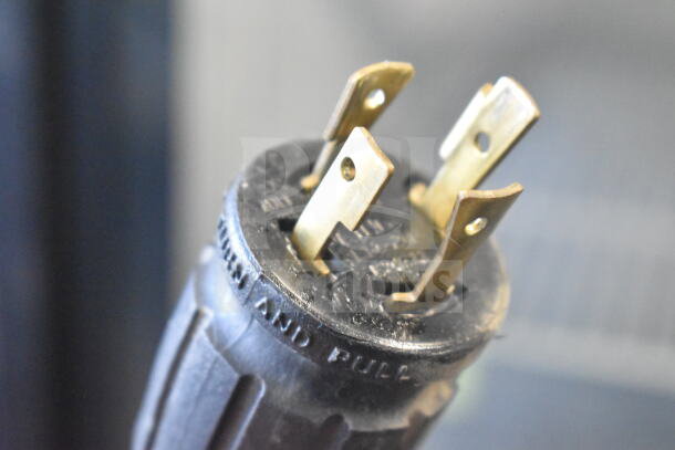 Close-up of electrical plug prongs for a True GDM-72F-HC freezer, tested and working, 115/208-230 volts, 1 phase.