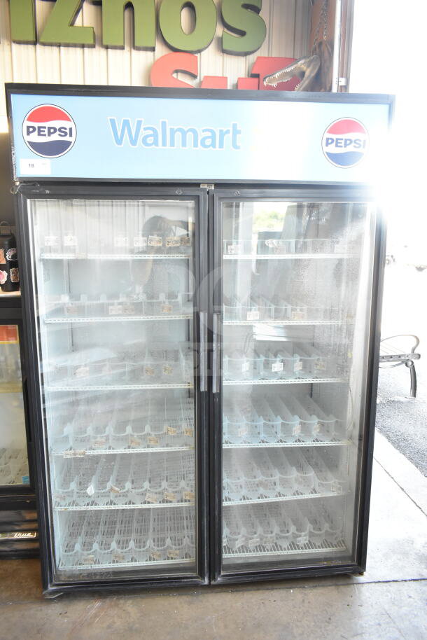 True GDM-52TM-RL-LD commercial 2-door reach-in cooler merchandiser, Pepsi and Walmart branding, glass doors, good condition.