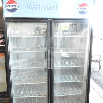 True GDM-52TM-RL-LD commercial 2-door reach-in cooler merchandiser, Pepsi and Walmart branding, glass doors, good condition.