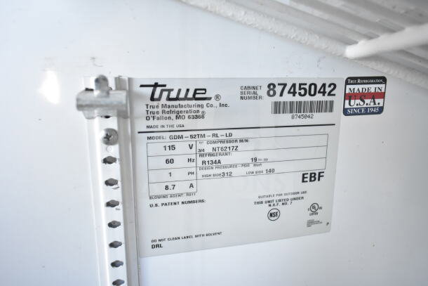True GDM-52TM-RL-LD cooler label, showing model, voltage (115V), phase (1), and compressor details. Made in the USA.