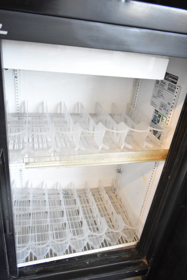 2019 True GDM-41SL-48-HC-LD commercial cooler, 2-door, reach-in, 115V, good condition, interior shelves, label visible.