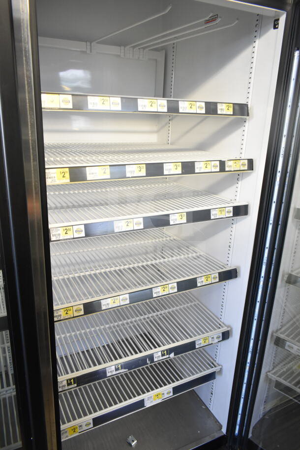 2016 True GDM-72-HC 3 Door Reach-In Cooler, commercial use, white interior, tested working, tags show shelving prices.