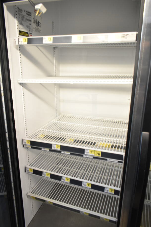 2016 True GDM-72-HC 3 Door Reach-In Cooler Merchandiser, 115V, 1 Phase, tested, working. Shelves inside with labels.