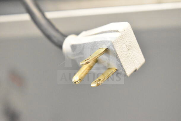 Close-up of the plug for a 2016 True GDM-72-HC Commercial 3 Door Reach In Cooler, 115 volts, 1 phase.