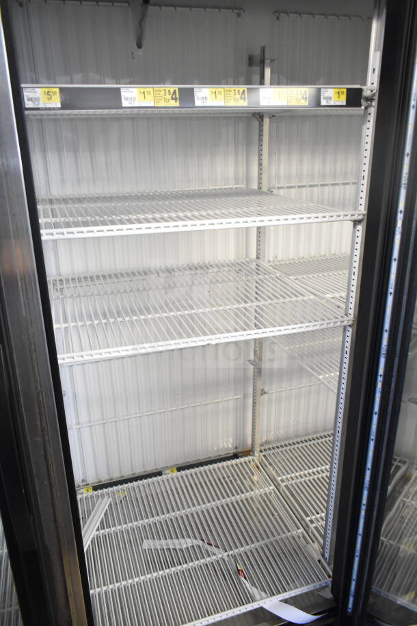 2016 True GDM-72F-HC commercial 3-door freezer merchandiser with wire shelves. Tested and working. 115/208-230V, 1 Phase.