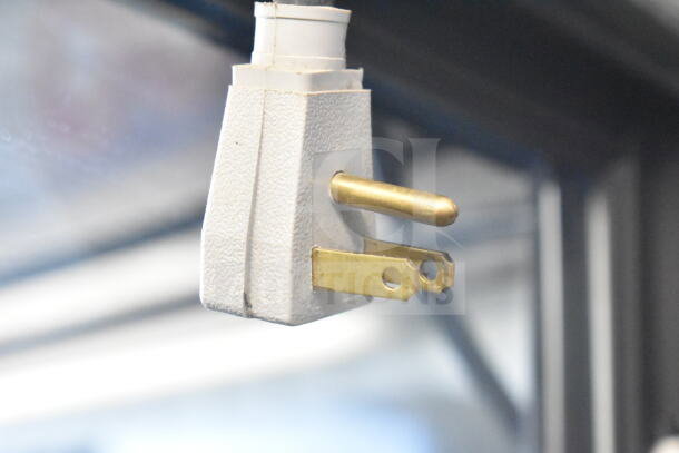 Close-up of a power plug for the 2016 True GDM-72-HC Commercial 3 Door Reach In Cooler Merchandiser, 115 Volts, 1 Phase.