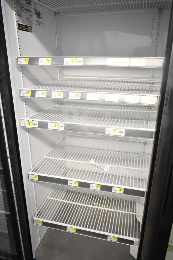 2016 True GDM-72-HC commercial 3-door reach-in cooler merchandiser, 115 volts, 1 phase, tested and working, empty interior shelves.