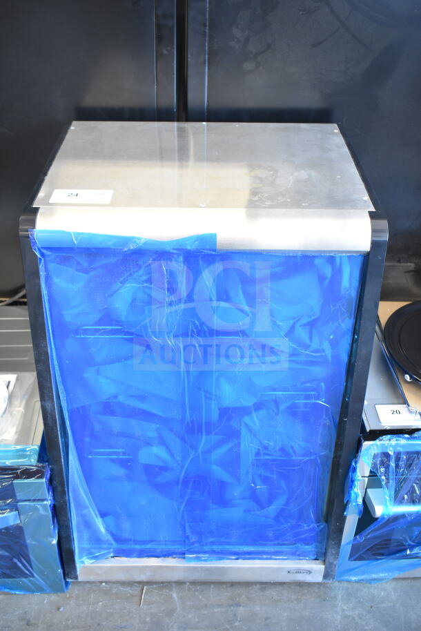 Brand new scratched KoolMore CDC-49-SS countertop bakery display fridge, 4 tiers, 24 in., blue protective wrap. 110-120V, 1 phase.