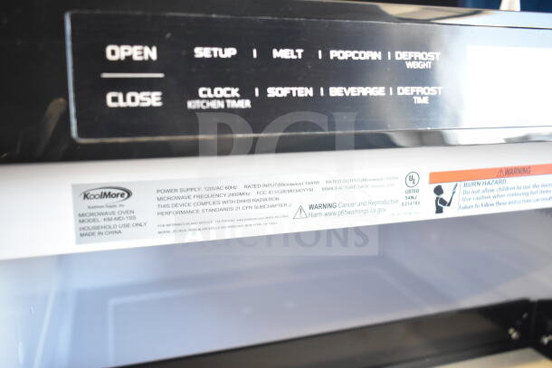 BRAND NEW KoolMore KM-MD-1SS stainless-steel microwave drawer, 1.2 Cu. Ft., wall-mounted, includes control panel and warning labels.