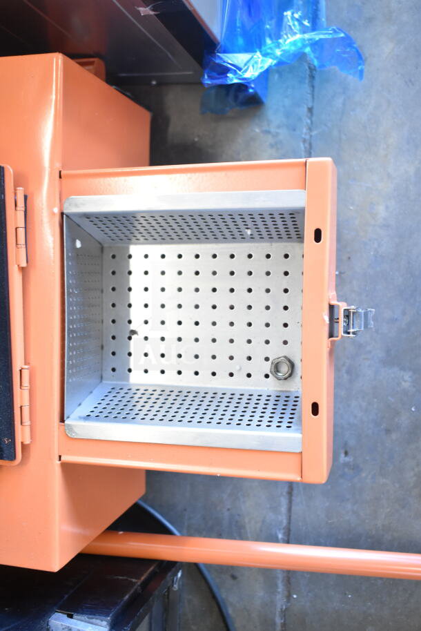 BRAND NEW SCRATCH AND DENT Fryclone 259DISPL00, 100 lb. fryer oil disposal unit. Orange exterior, perforated interior.