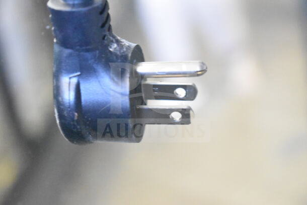 Close-up of a power plug for a 2018 True GDM-49-HC Commercial Cooler, indicating 115 volts, 1 phase compatibility.