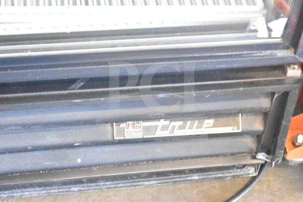 True GDM-12 Commercial Cooler Merchandiser, black exterior, visible True logo. 115 Volts, 1 Phase.