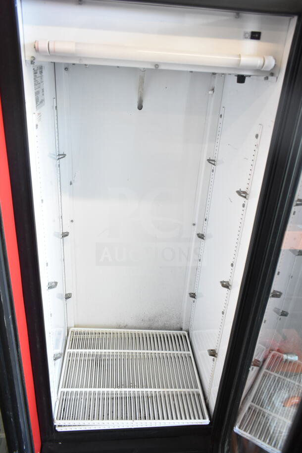 True GDM-12 commercial cooler merchandiser, single door, shelves, 115V, 1 phase. Interior slightly worn, clean condition.