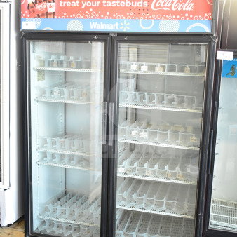 True GDM-52TM-RL-LD 2-door cooler merchandiser, tested and working, 115V, 1 phase, glass doors, in commercial setting.