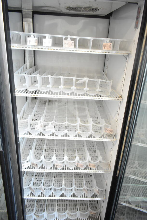 True GDM-52TM-RL-LD 2-door cooler merchandiser, tested and working, 115 volts, 1 phase, clean interior with adjustable shelves.