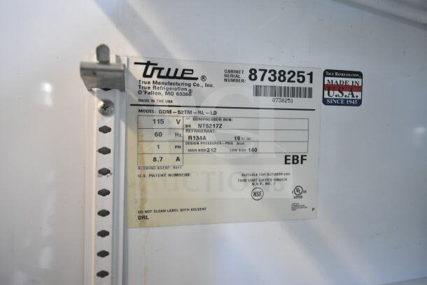 True GDM-52TM-RL-LD 2 Door Reach In Cooler, 115V, 1PH, model label showing specs, NSF and UL listed, Made in USA.