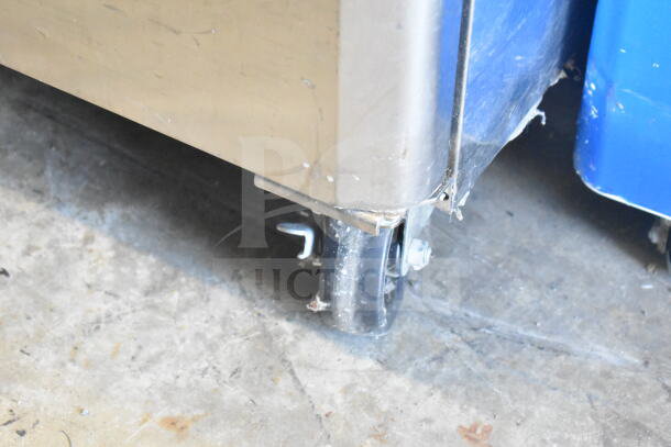 Turbo Air M3F24-1-N freezer corner on caster, showcasing durability and mobility on concrete floor.