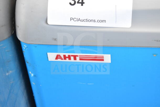 AHT RIO S 100 Commercial Freezer Merchandiser on casters, 115V, 1 phase, tested and working, visible AHT logo.