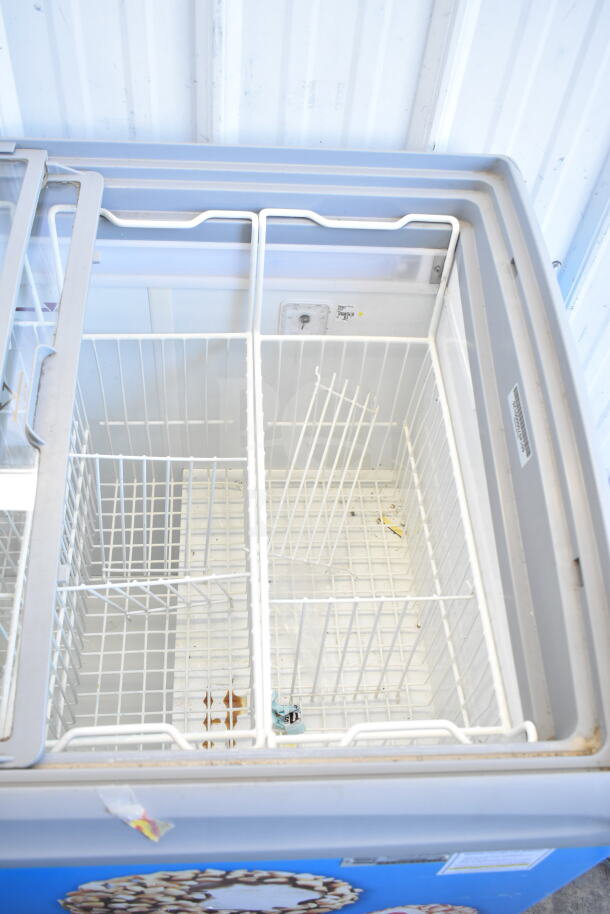 AHT RIO S 100 commercial freezer merchandiser with glass top and metal wire baskets, on casters, 115V, tested and working.