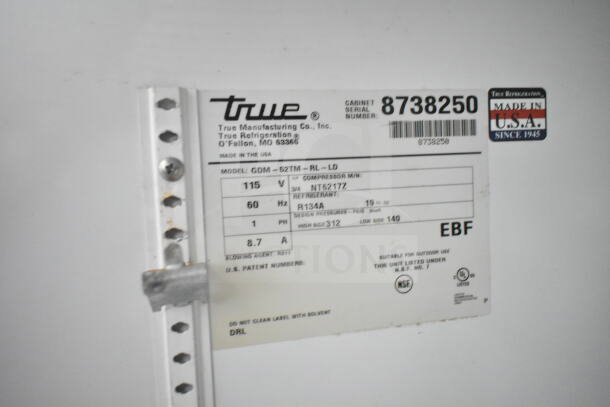 True GDM-52TM-RL-LD cooler label showing specs: 115V, 60Hz, refrigerant R134A, serial number 8738250, made in USA.