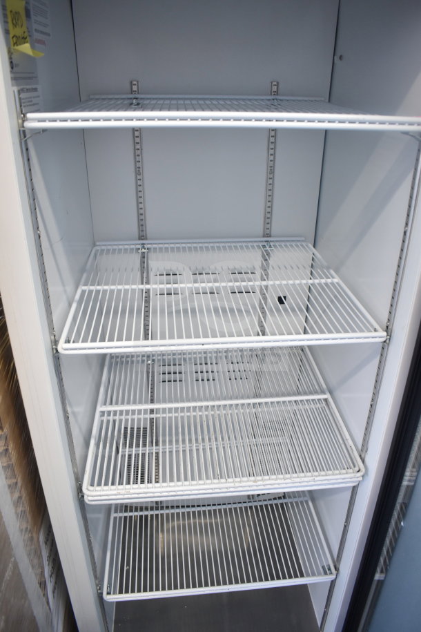 2019 Habco SE18 commercial single door reach-in cooler, 115 volts, excellent condition, adjustable shelves. Tags indicate model and voltage.