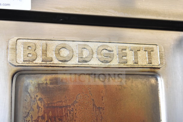 Blodgett BDO-100-G-ES convection oven showing brand label, stainless steel exterior, visible wear. 45,000 BTU capacity.