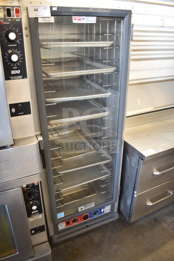 Metro 519-CFC-4 commercial heated holding cabinet on casters, stainless steel, multiple shelves, control knobs, used condition.