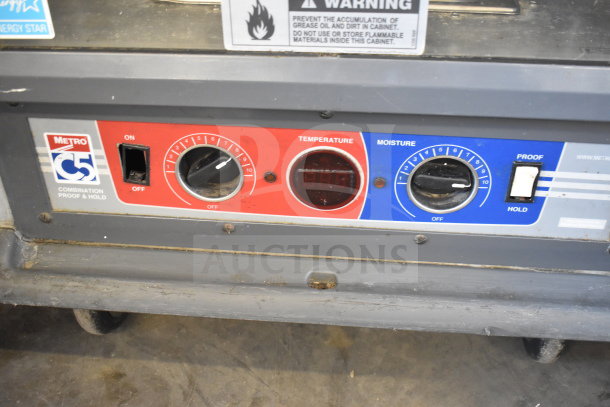 Metro 519-CFC-4 Commercial Heated Holding Cabinet control panel with temperature and moisture settings, on casters.